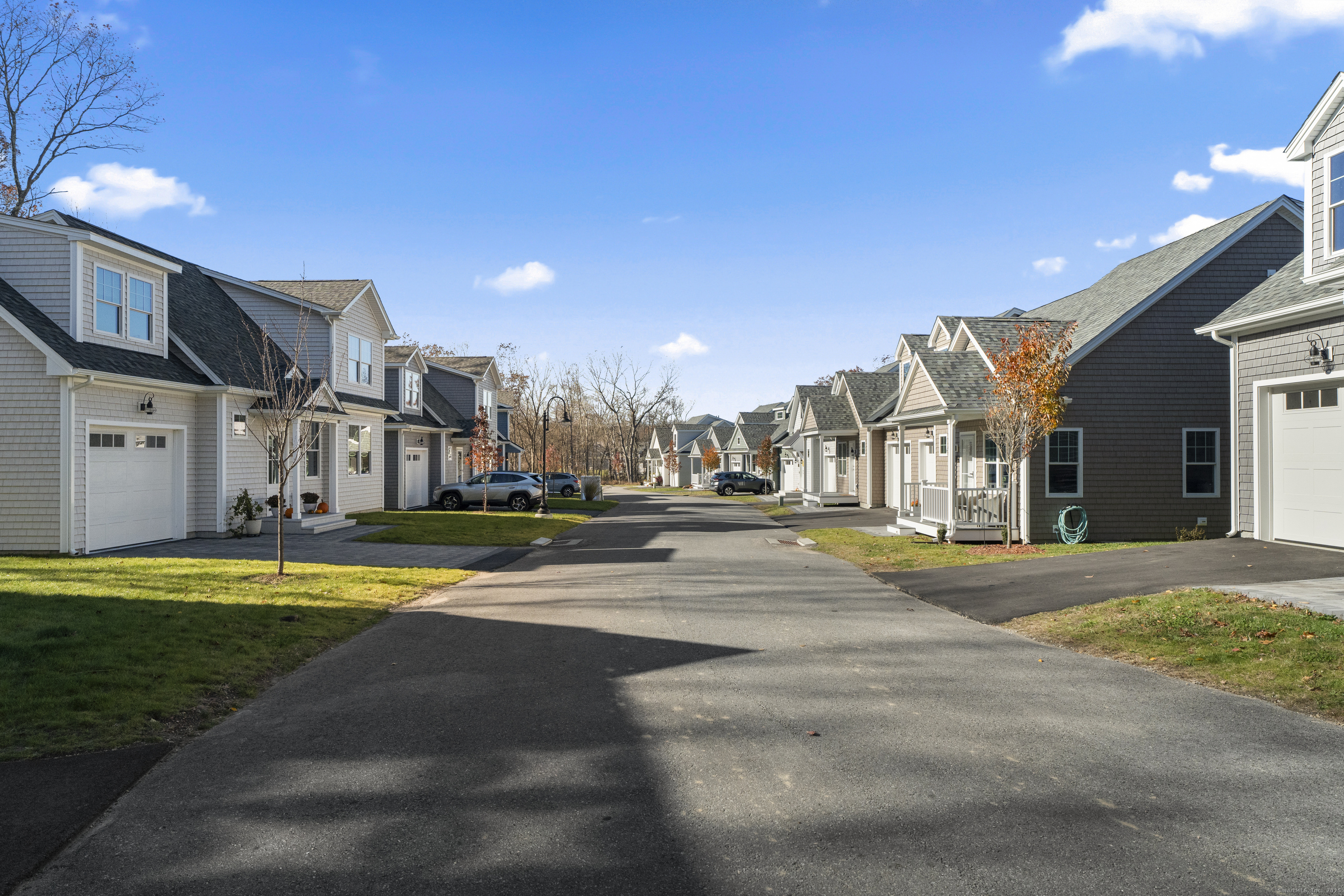 34 Ivy Hill Road, Unit 34 Waterford, CT 06385 - Photo 15 of 36 a view of a swimming pool with a bench in front of it