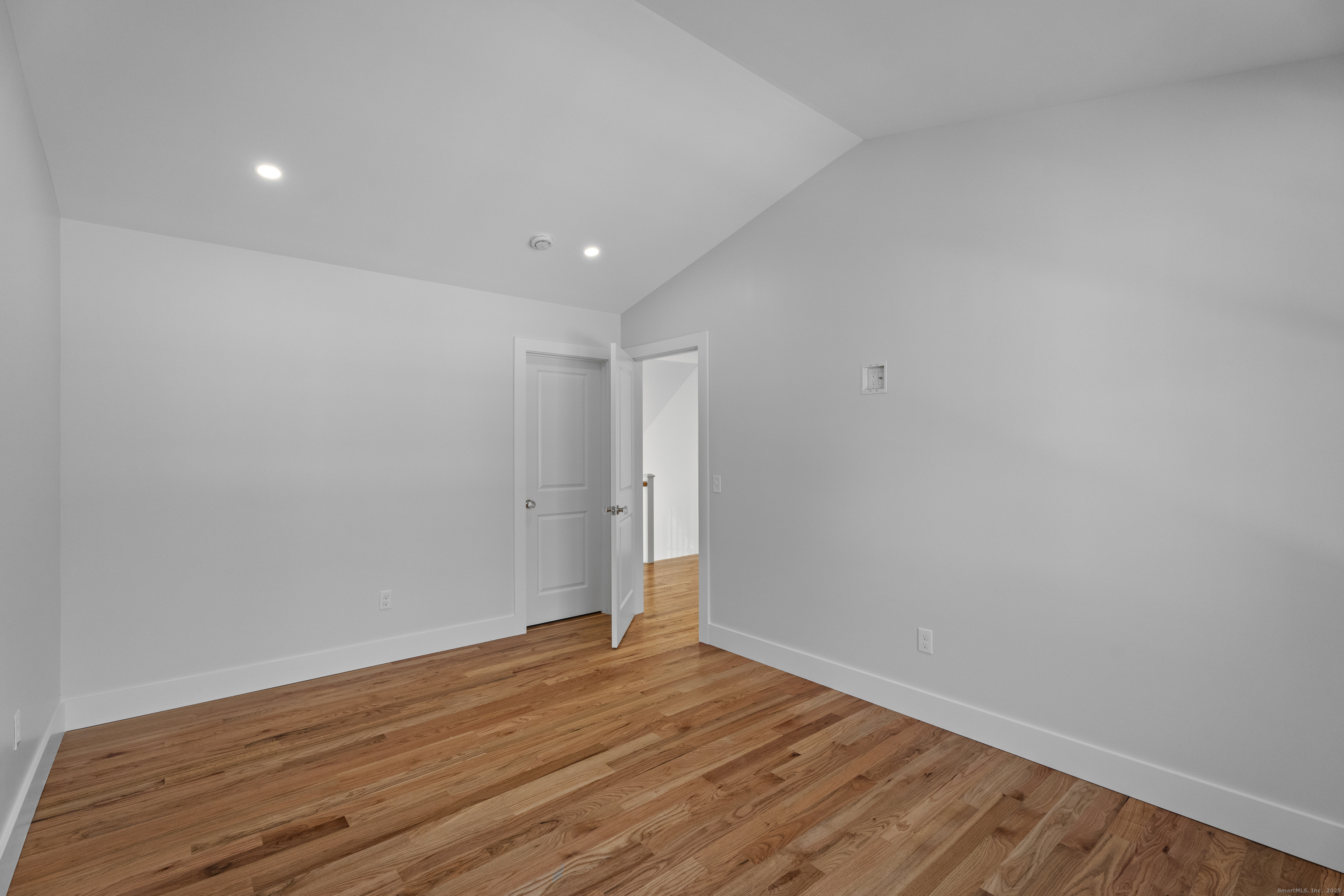 34 Ivy Hill Road, Unit 34 Waterford, CT 06385 - Photo 20 of 33 a view of room with wooden floor and white walls
