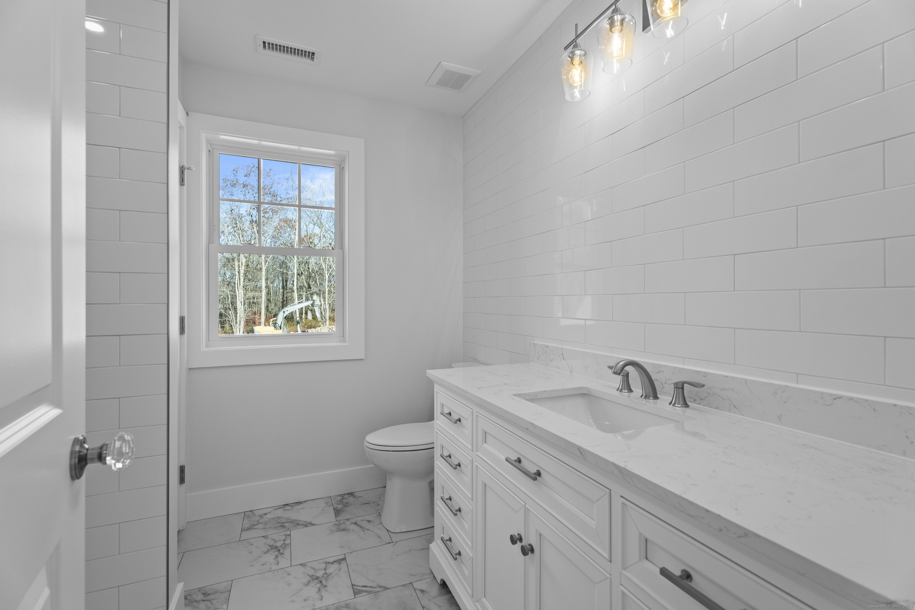 34 Ivy Hill Road, Unit 34 Waterford, CT 06385 - Photo 2 of 36 a bathroom with a sink toilet and shower