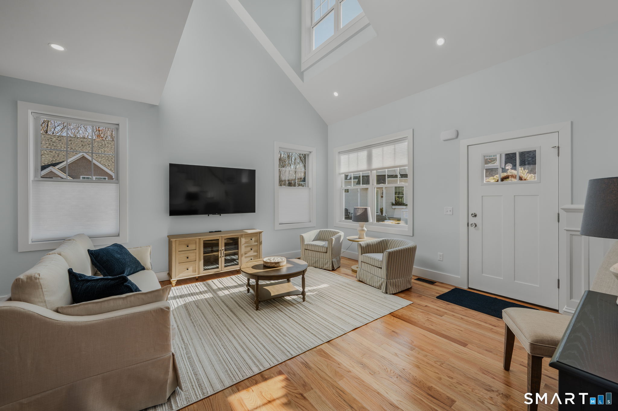 34 Ivy Hill Road, Unit 34 Waterford, CT 06385 - Photo 23 of 36 a living room with furniture and a flat screen tv