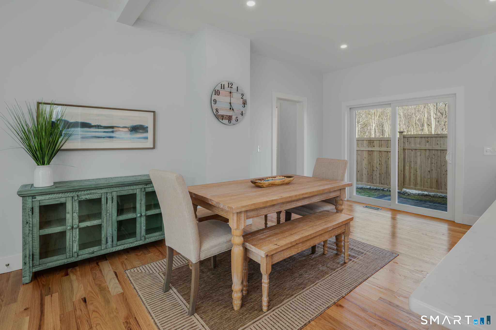 34 Ivy Hill Road, Unit 34 Waterford, CT 06385 - Photo 28 of 36 a room with a table and a rug