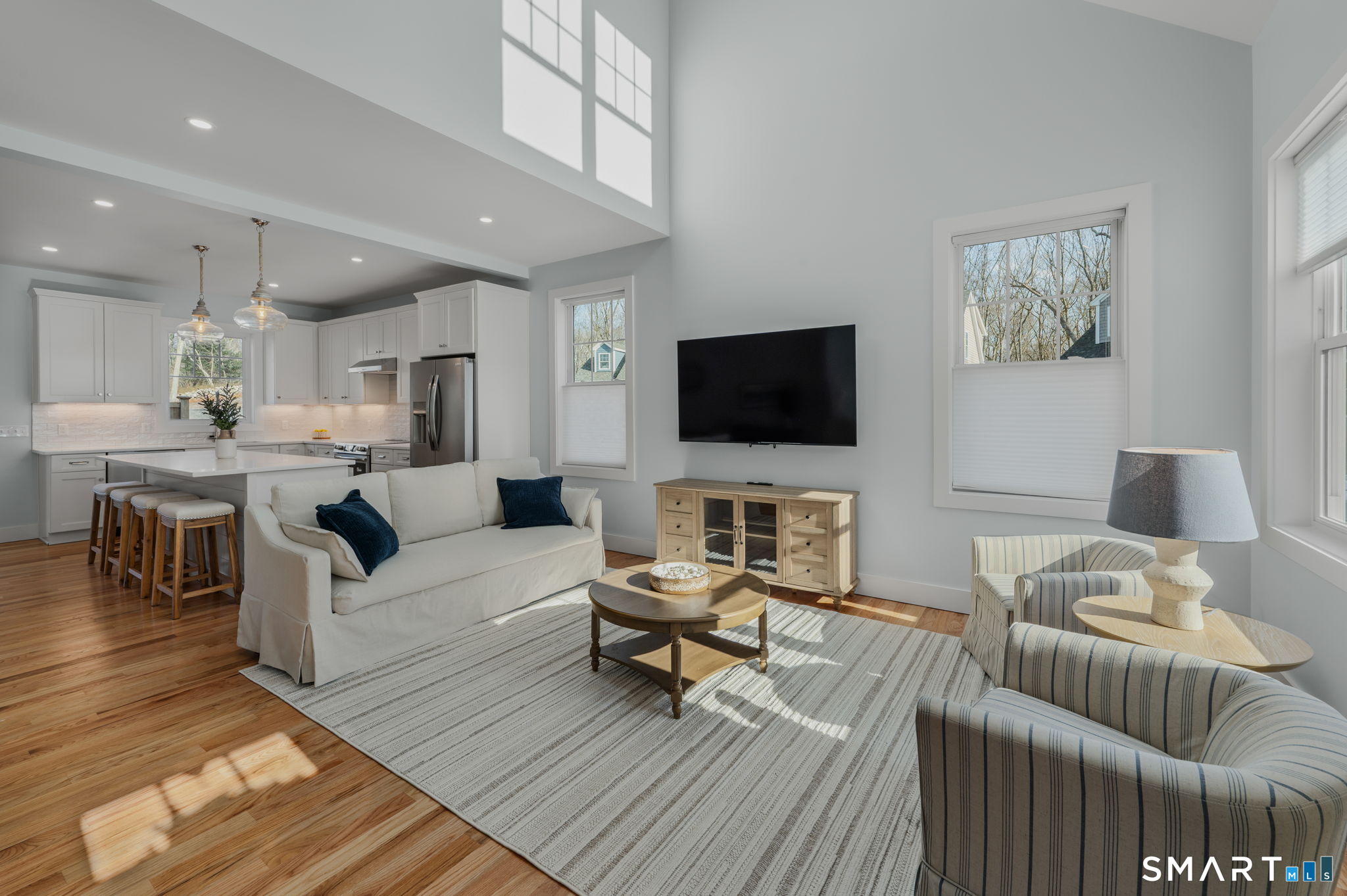 34 Ivy Hill Road, Unit 34 Waterford, CT 06385 - Photo 31 of 36 a living room with furniture and a flat screen tv