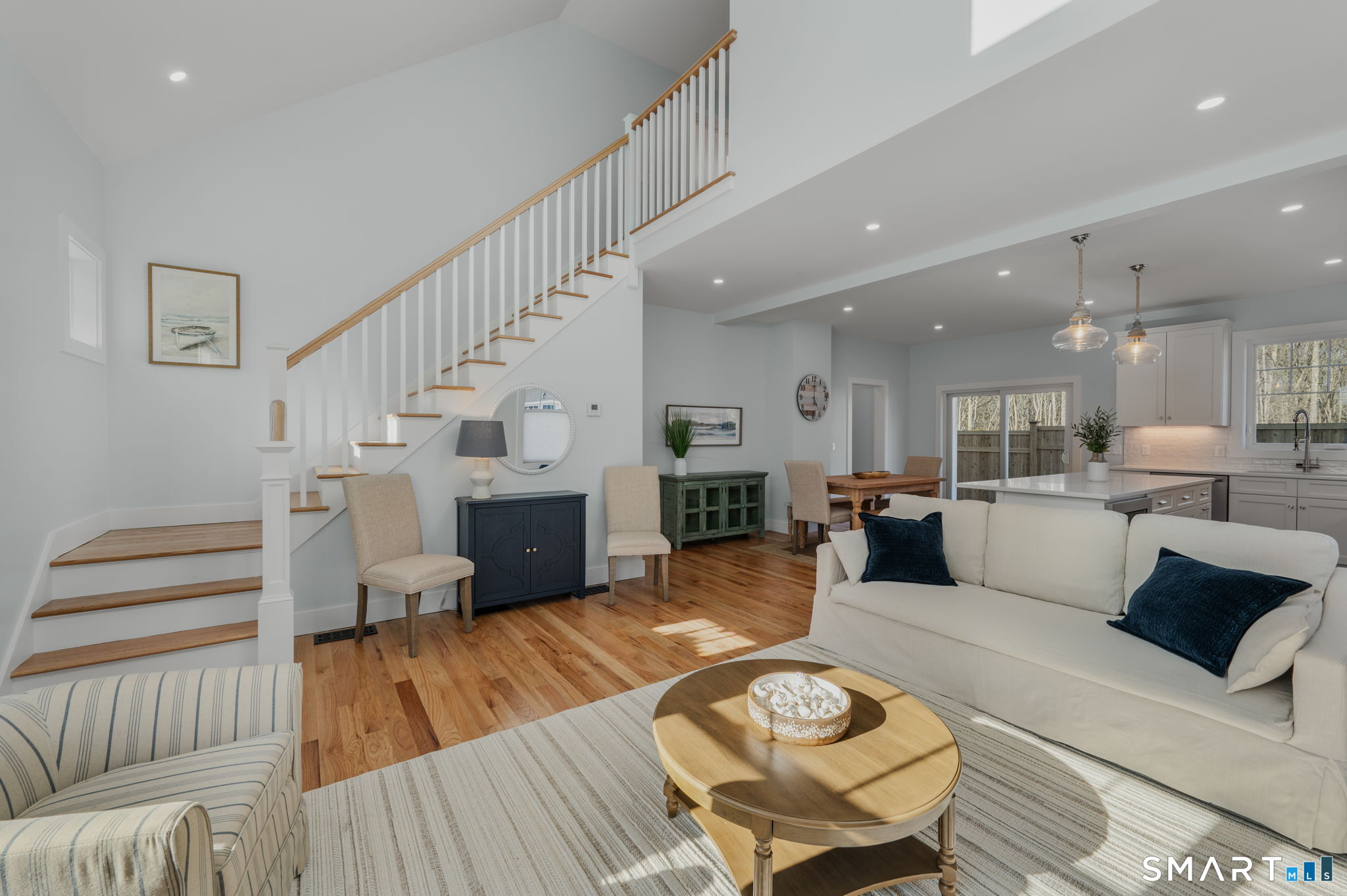 34 Ivy Hill Road, Unit 34 Waterford, CT 06385 - Photo 32 of 36 a living room with furniture and a wooden floor