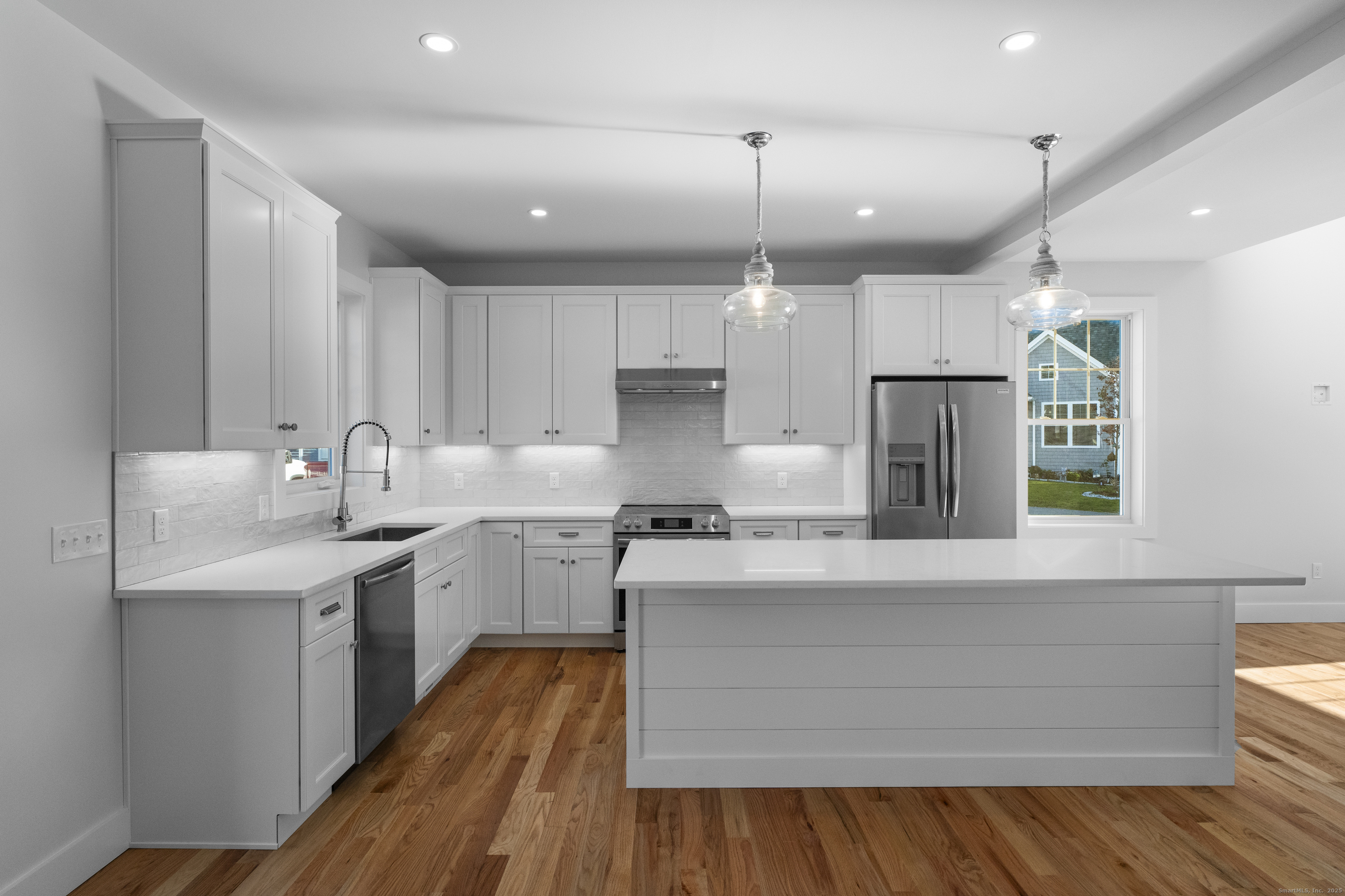 34 Ivy Hill Road, Unit 34 Waterford, CT 06385 - Photo 6 of 33 a kitchen with stainless steel appliances granite countertop a sink a stove and a refrigerator