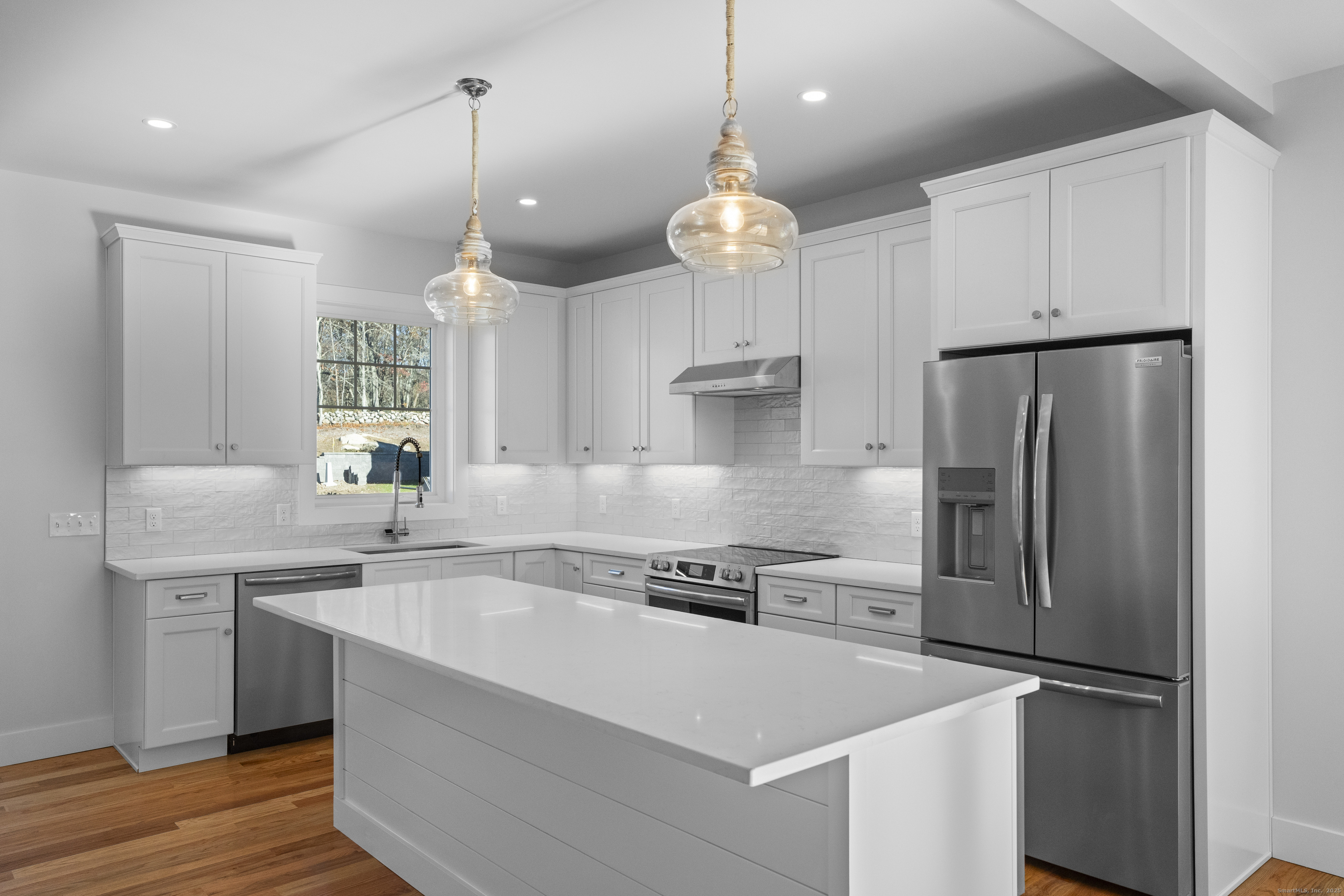 34 Ivy Hill Road, Unit 34 Waterford, CT 06385 - Photo 7 of 33 a kitchen with a refrigerator a sink and cabinets