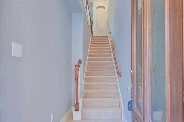 a view of a hallway with a white door