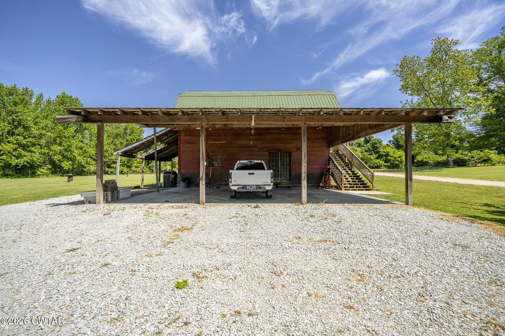 61 Con Pennington Road Kenton, TN 38233 - Photo 14 of 46 a view of a car park in front of a house with a yard