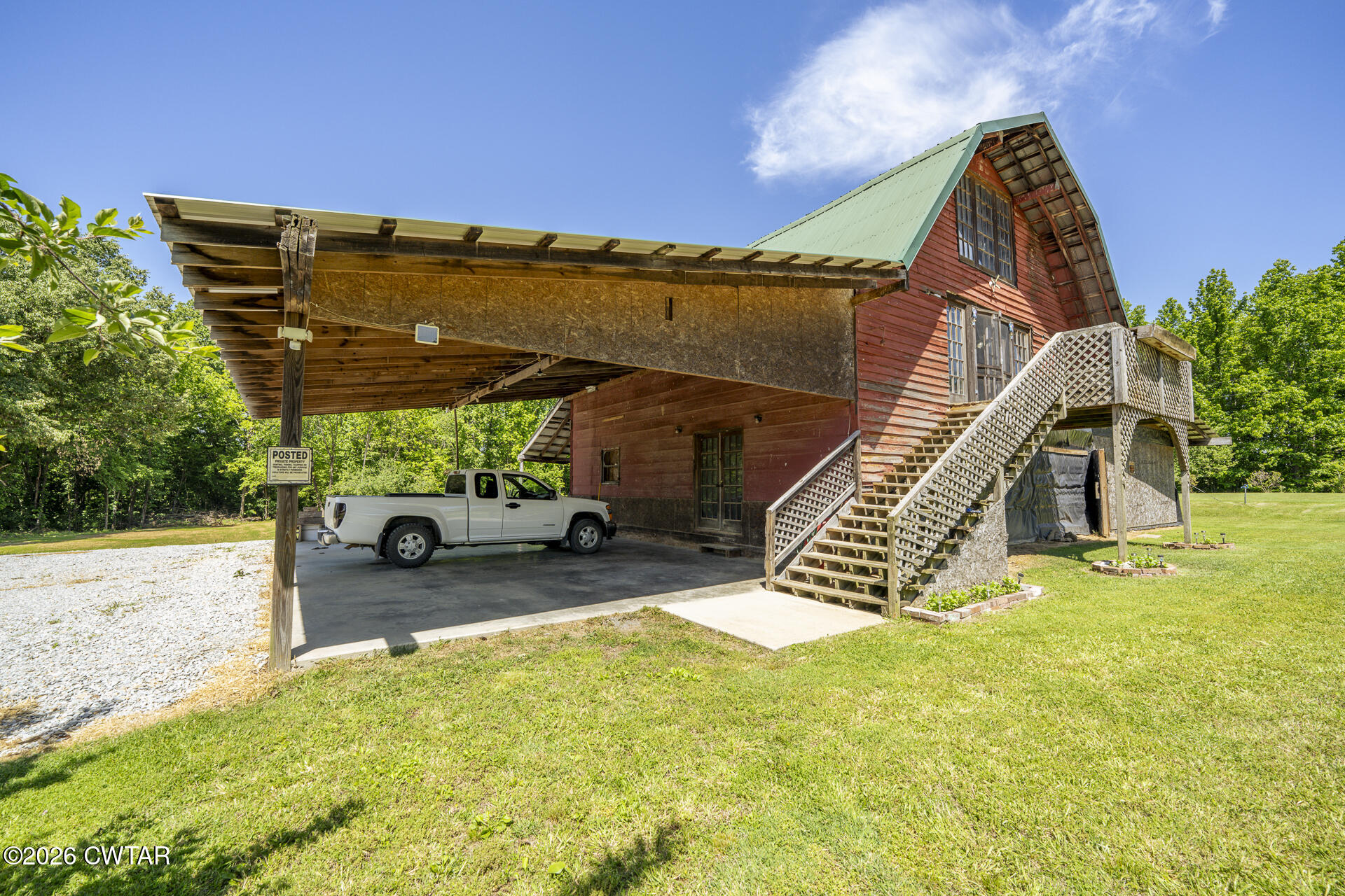61 Con Pennington Road Kenton, TN 38233 - Photo 16 of 46 a view of a house with backyard and sitting area