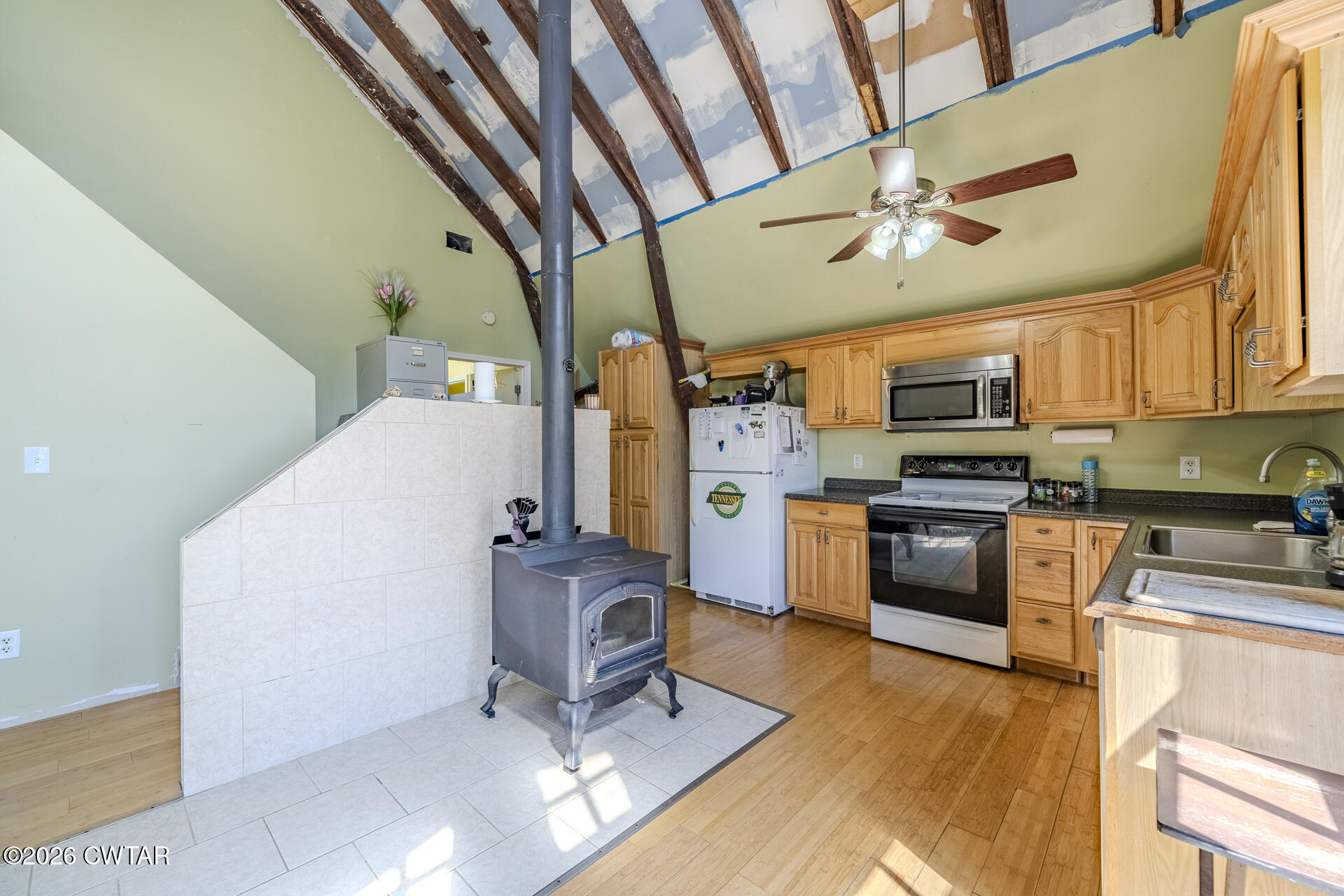61 Con Pennington Road Kenton, TN 38233 - Photo 20 of 46 a kitchen with stainless steel appliances kitchen island granite countertop a refrigerator a stove top oven a sink and dishwasher