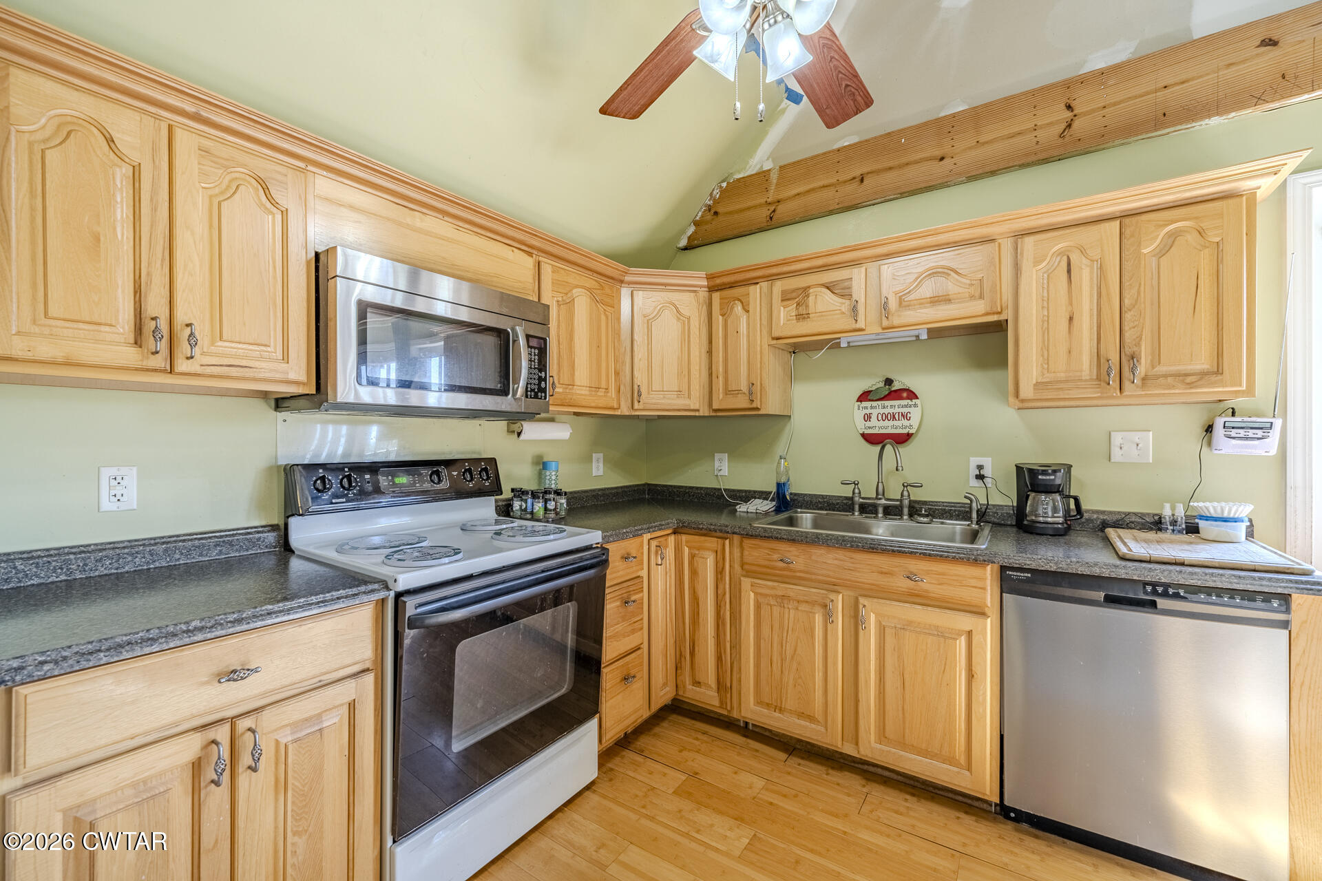 61 Con Pennington Road Kenton, TN 38233 - Photo 21 of 46 a kitchen with granite countertop a sink cabinets stainless steel appliances and a window