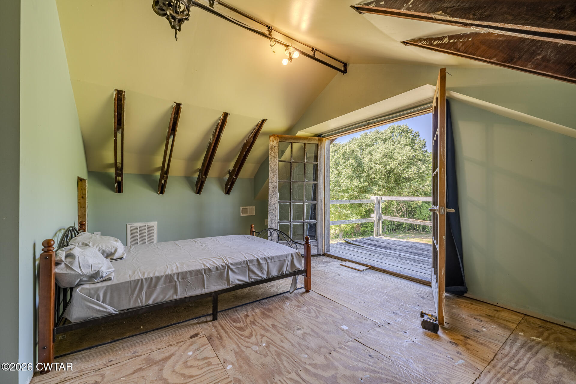 61 Con Pennington Road Kenton, TN 38233 - Photo 26 of 46 a bedroom with a bed and wooden floor