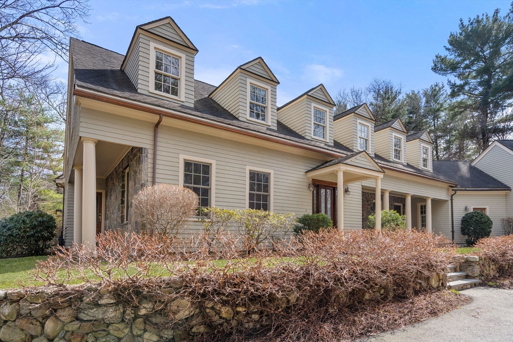 80 Loring Road Weston, MA 02493 - Photo 1 of 28 a front view of a house with garden