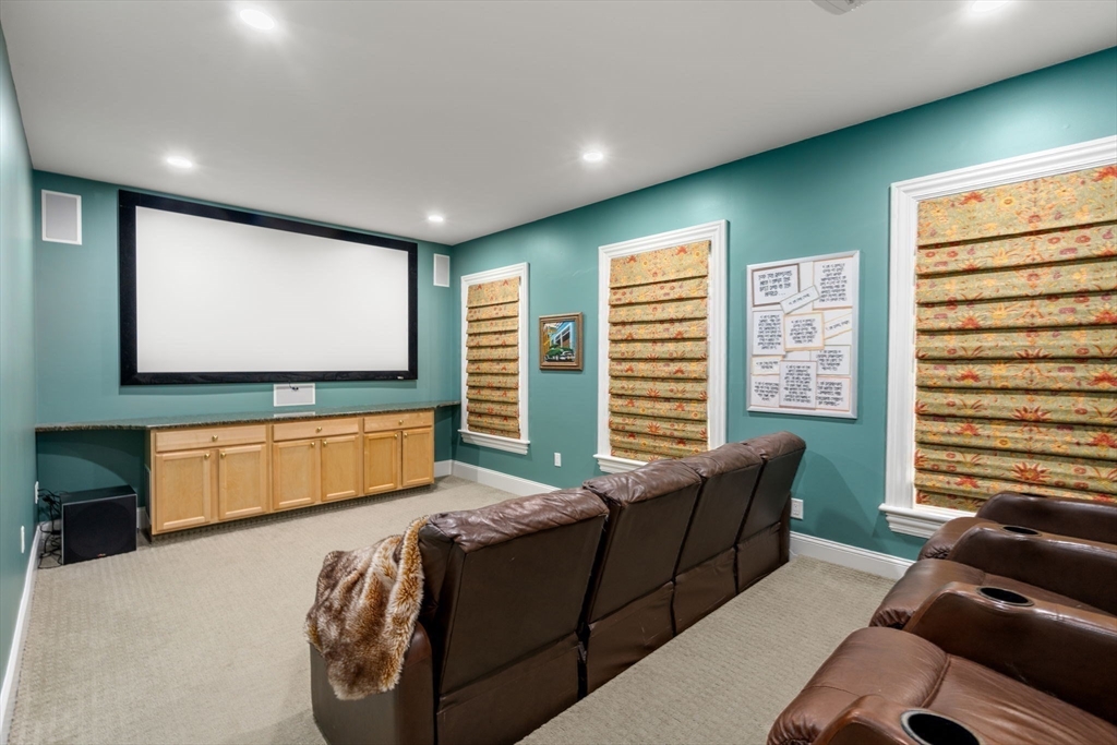 80 Loring Road Weston, MA 02493 - Photo 17 of 28 a living room with furniture and a flat screen tv