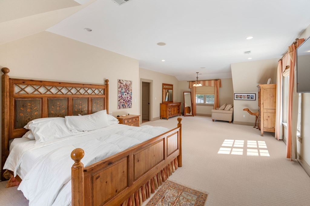 80 Loring Road Weston, MA 02493 - Photo 23 of 28 a bedroom with a bed and a large window