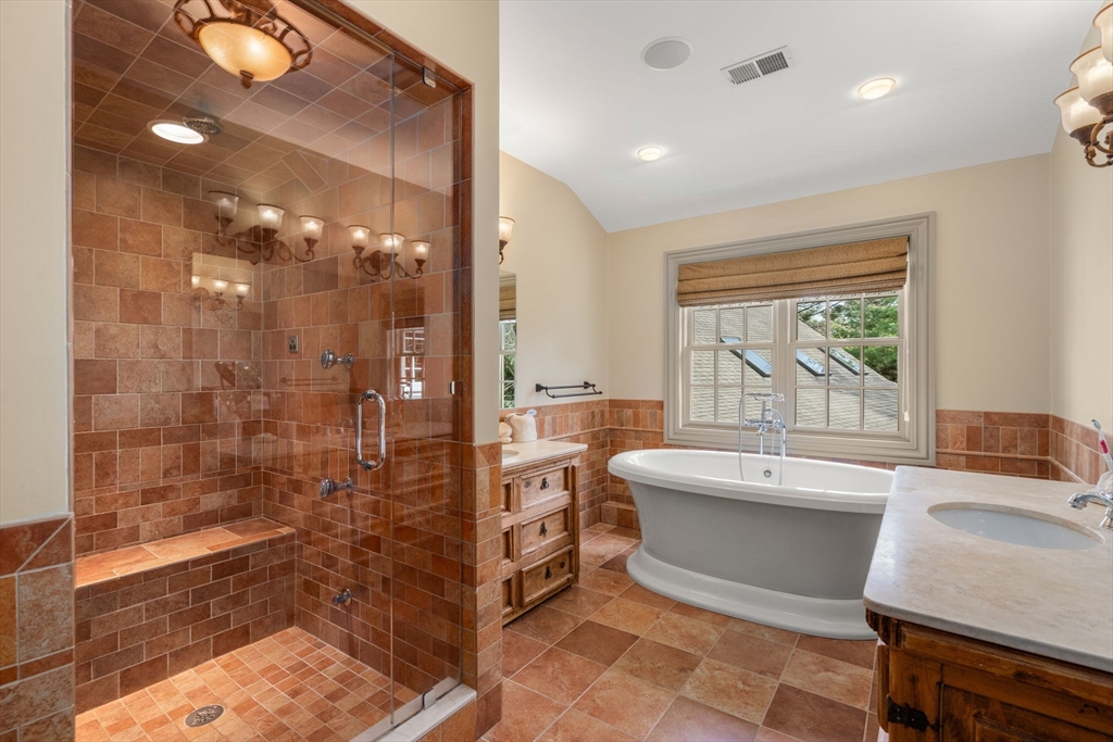 80 Loring Road Weston, MA 02493 - Photo 24 of 28 a bathroom with a bathtub and a sink