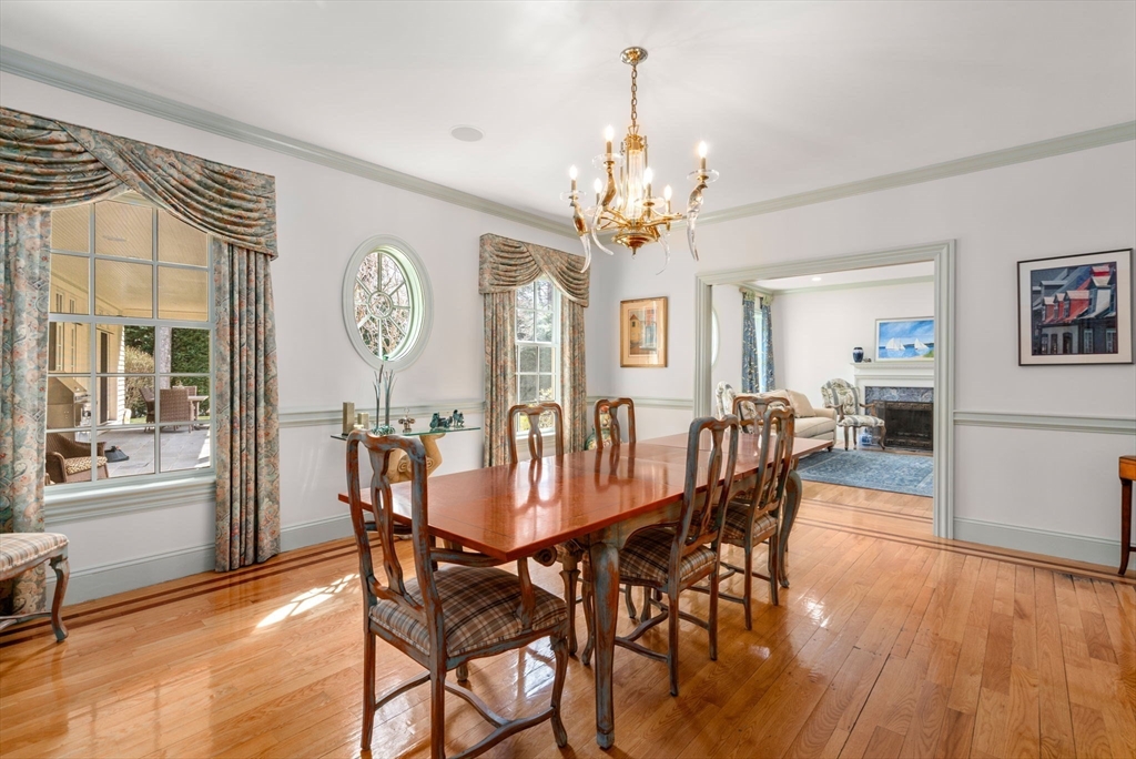 80 Loring Road Weston, MA 02493 - Photo 3 of 28 a view of a dining room with furniture a chandelier and wooden floor