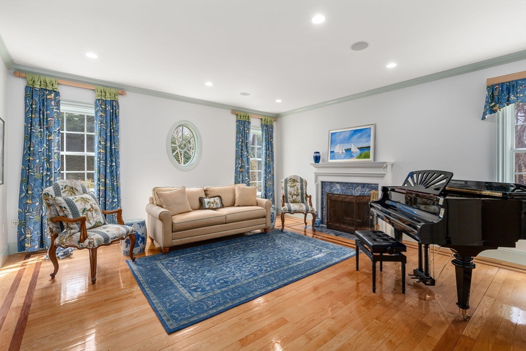80 Loring Road Weston, MA 02493 - Photo 4 of 28 a living room with furniture and a fireplace