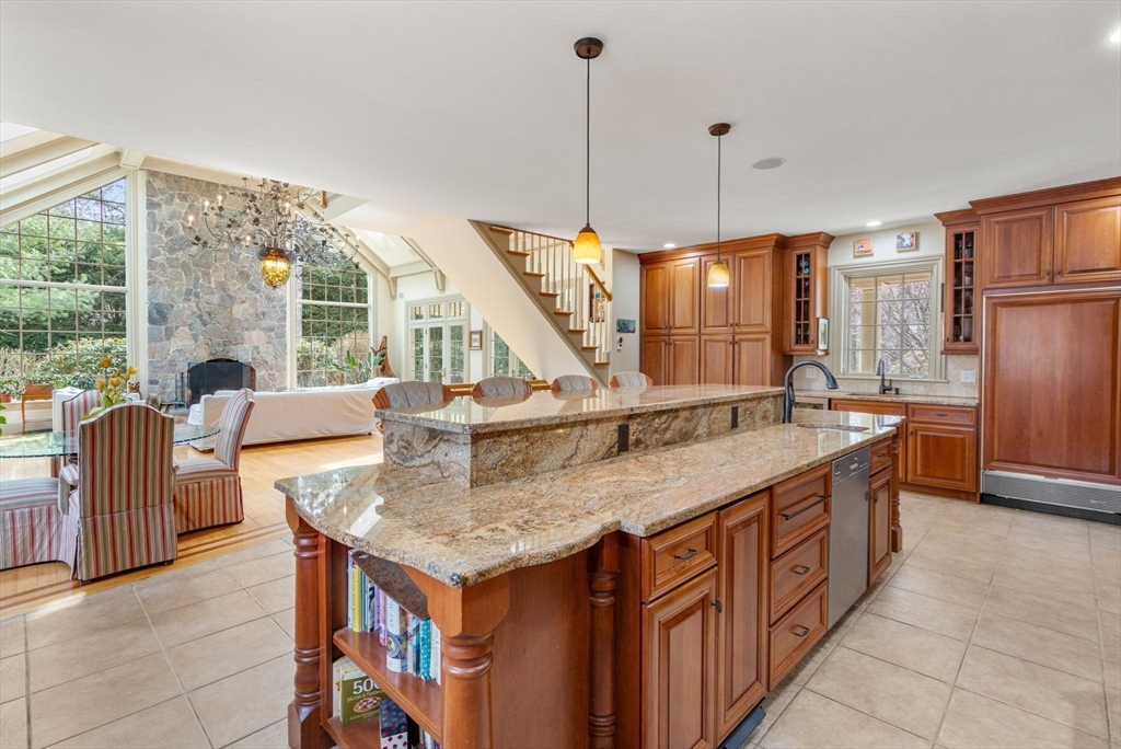80 Loring Road Weston, MA 02493 - Photo 9 of 28 a kitchen with stainless steel appliances granite countertop a sink a stove and a refrigerator