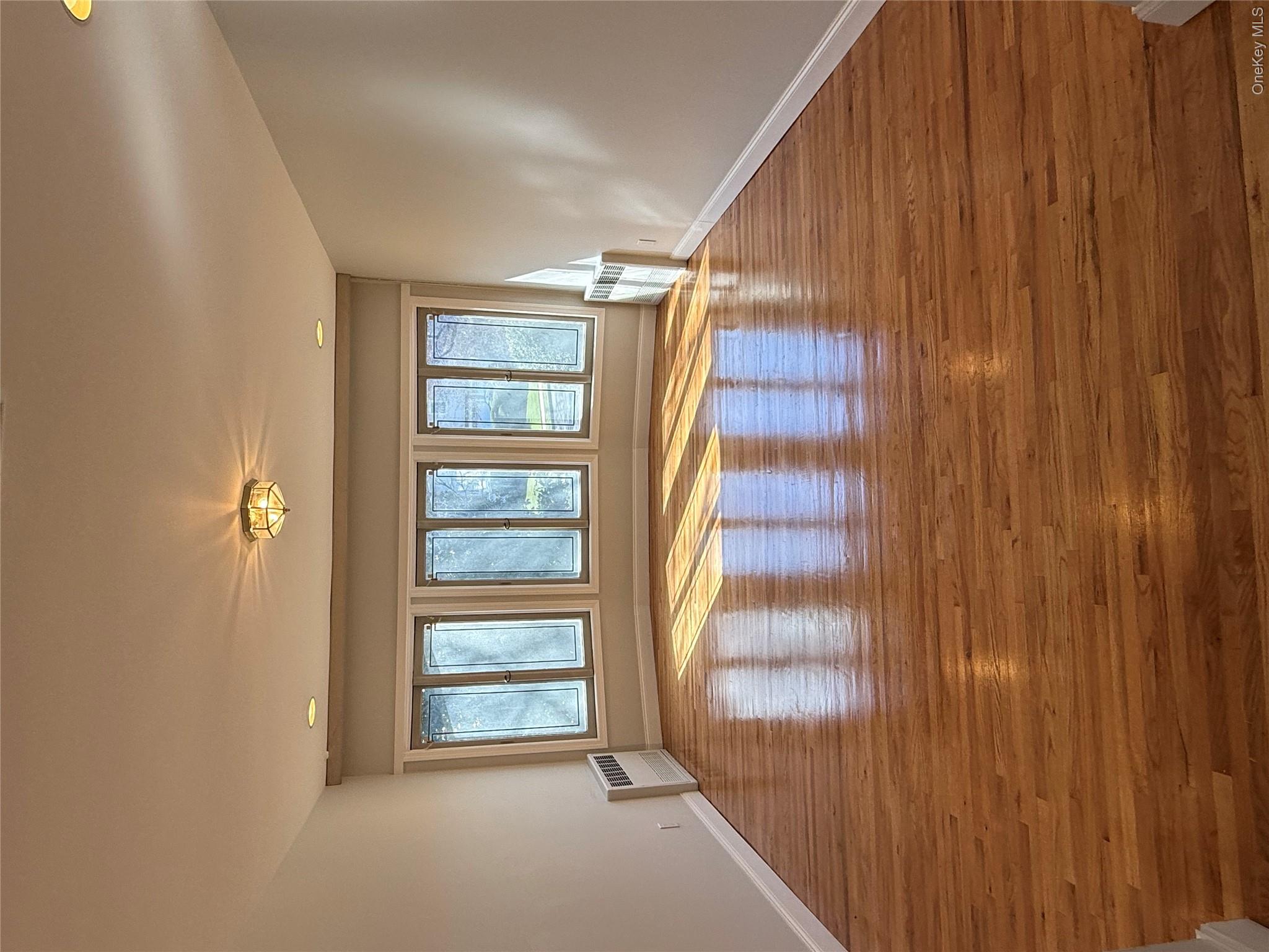 30 Dogwood Road Albertson, NY 11507 - Photo 8 of 20 The FORMAL DINING room features hardwood floors, a bay window with multiple panes, and recessed lighting in the ceiling