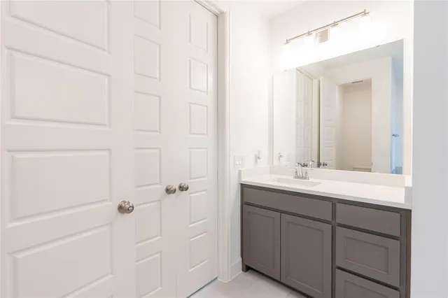 a room with a sink and cabinets