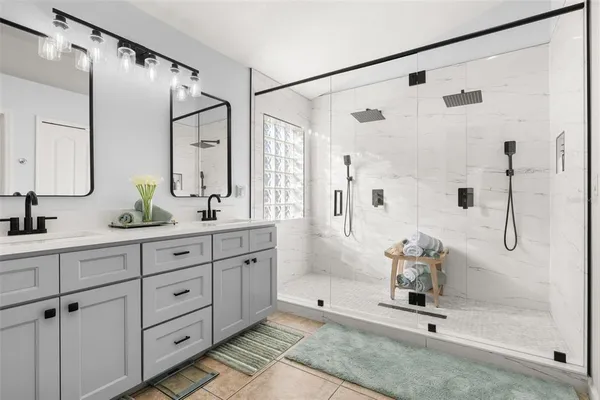 a bathroom with a bathtub and shower