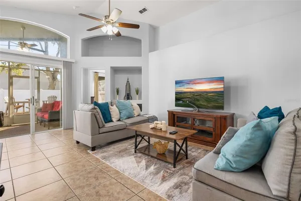a sitting area with furniture and rug