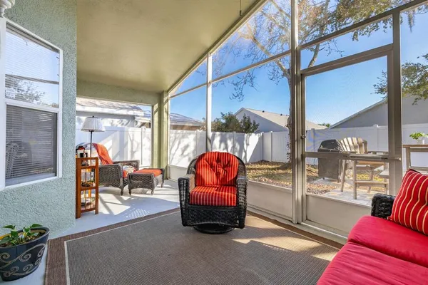 a living room with furniture a window and a fireplace