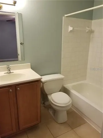 a bathroom with a sink a toilet and a bathtub