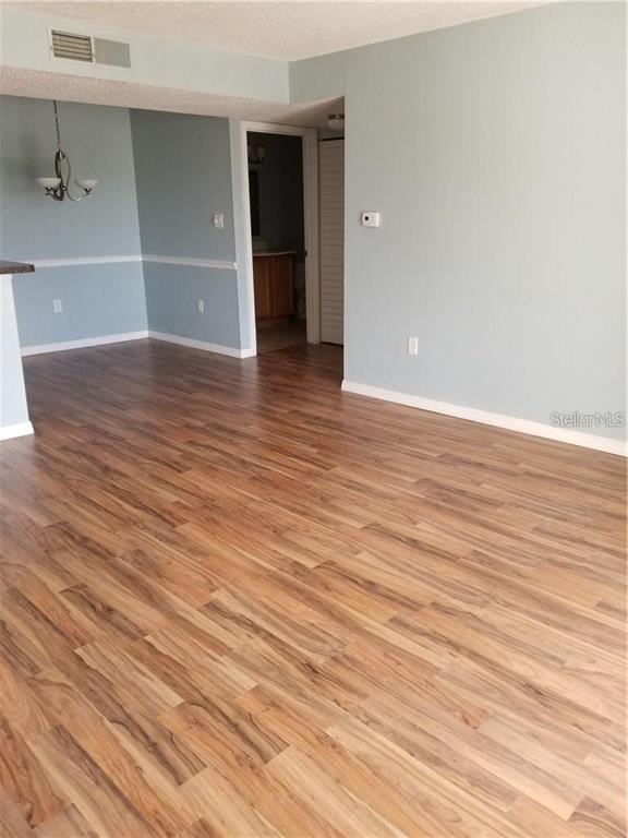 803 Lake Haven Square, Unit 202 Brandon, FL 33511 - Photo 15 of 17 wooden floor in an empty room