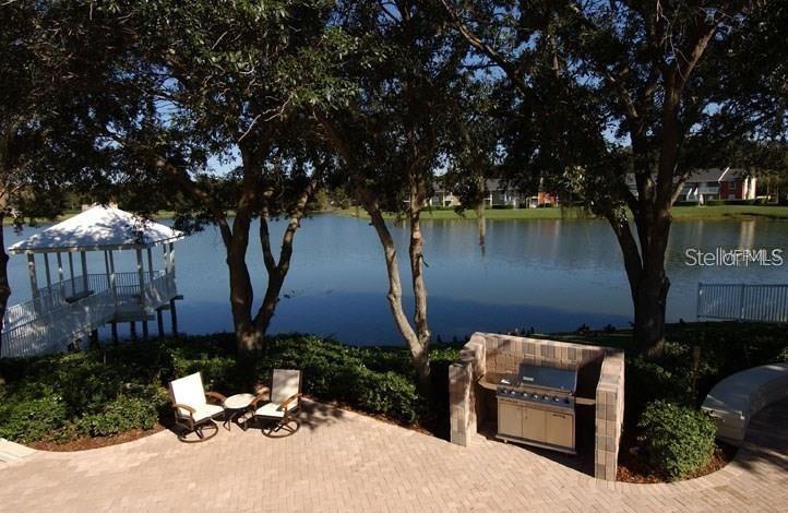 803 Lake Haven Square, Unit 202 Brandon, FL 33511 - Photo 5 of 17 a view of a house with backyard garden and sitting area