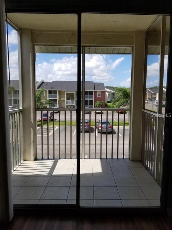 803 Lake Haven Square, Unit 202 Brandon, FL 33511 - Photo 7 of 17 a room with a bed and a large window