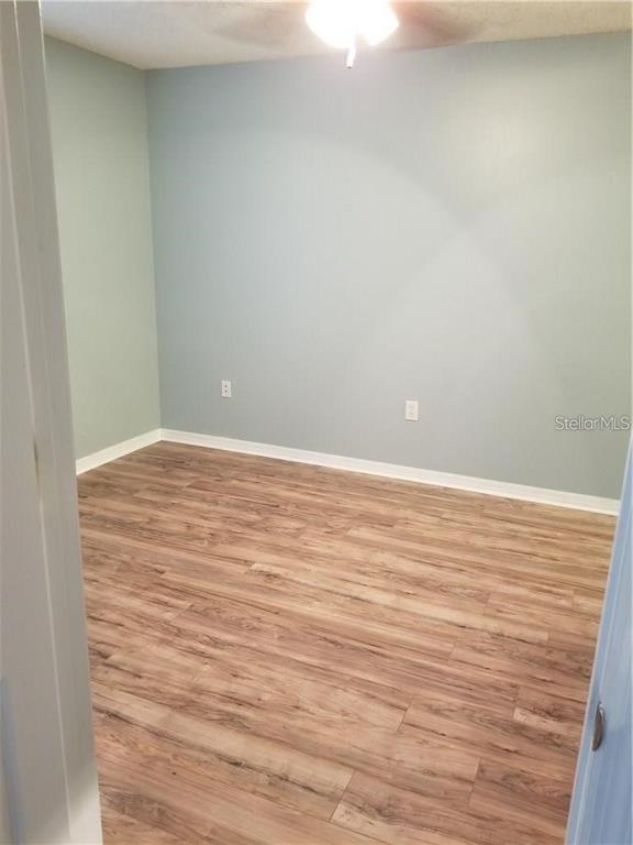 803 Lake Haven Square, Unit 202 Brandon, FL 33511 - Photo 10 of 17 a view of an empty room with wooden floor