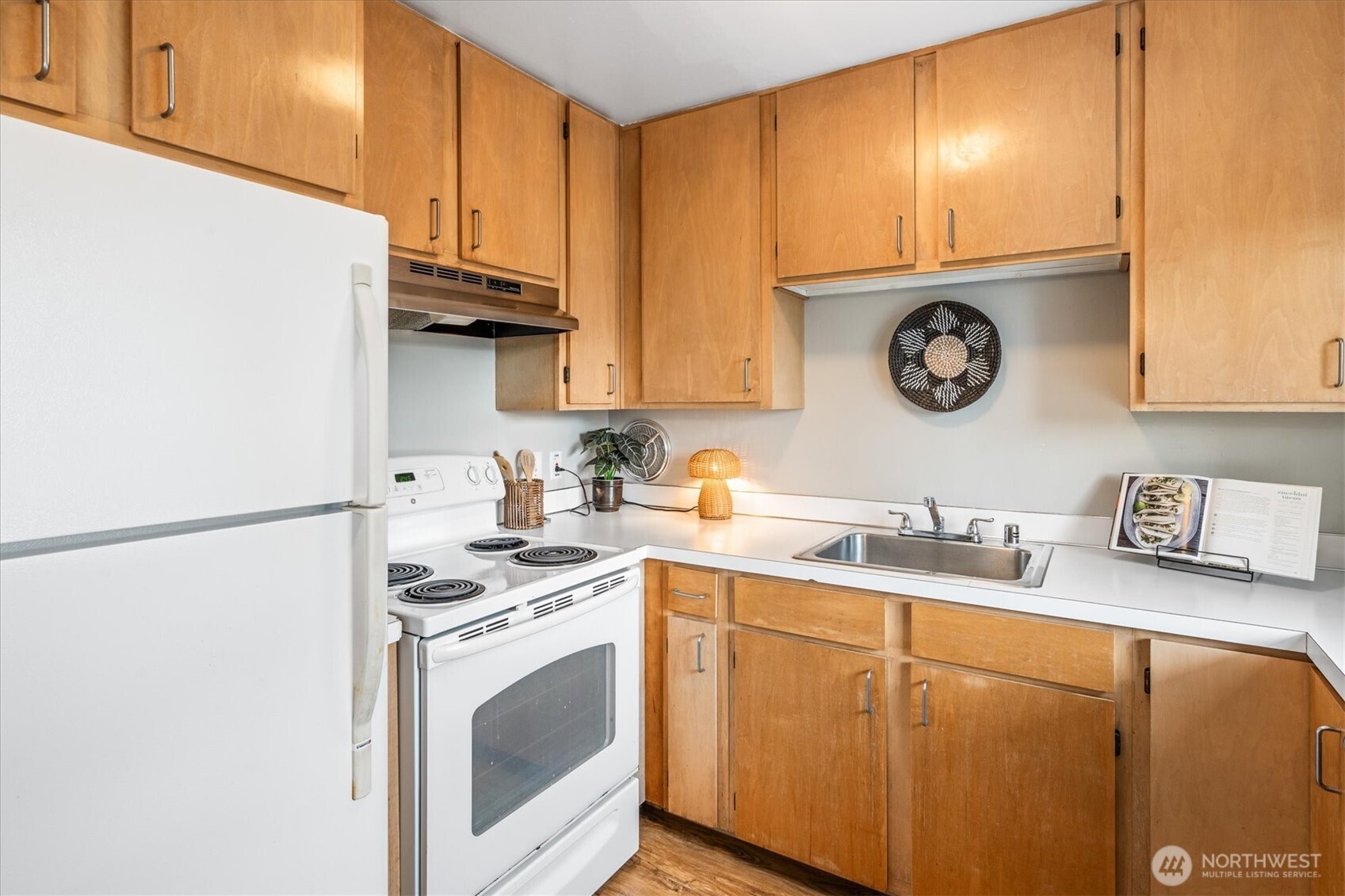 5638 3rd Avenue Northwest Seattle, WA 98107 - Photo 13 of 40 a kitchen with a sink a stove and cabinets