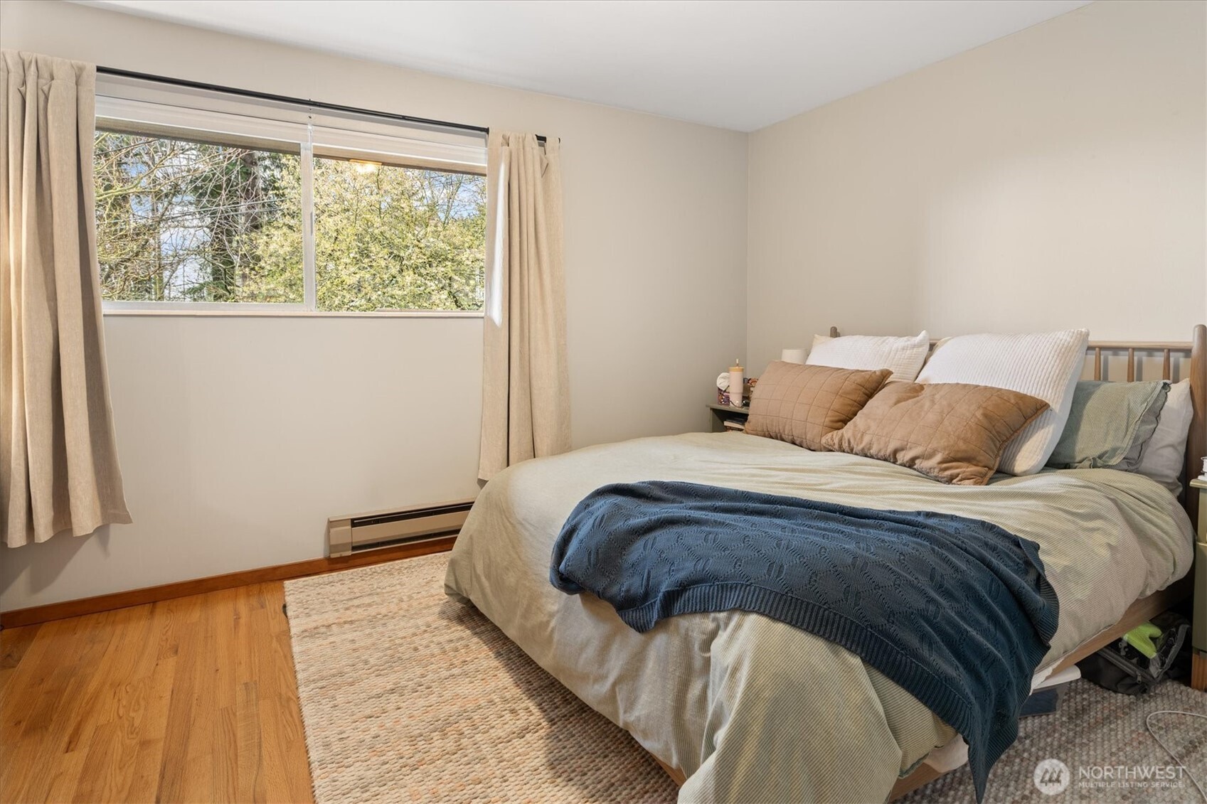5638 3rd Avenue Northwest Seattle, WA 98107 - Photo 25 of 40 a bedroom with a bed and a window