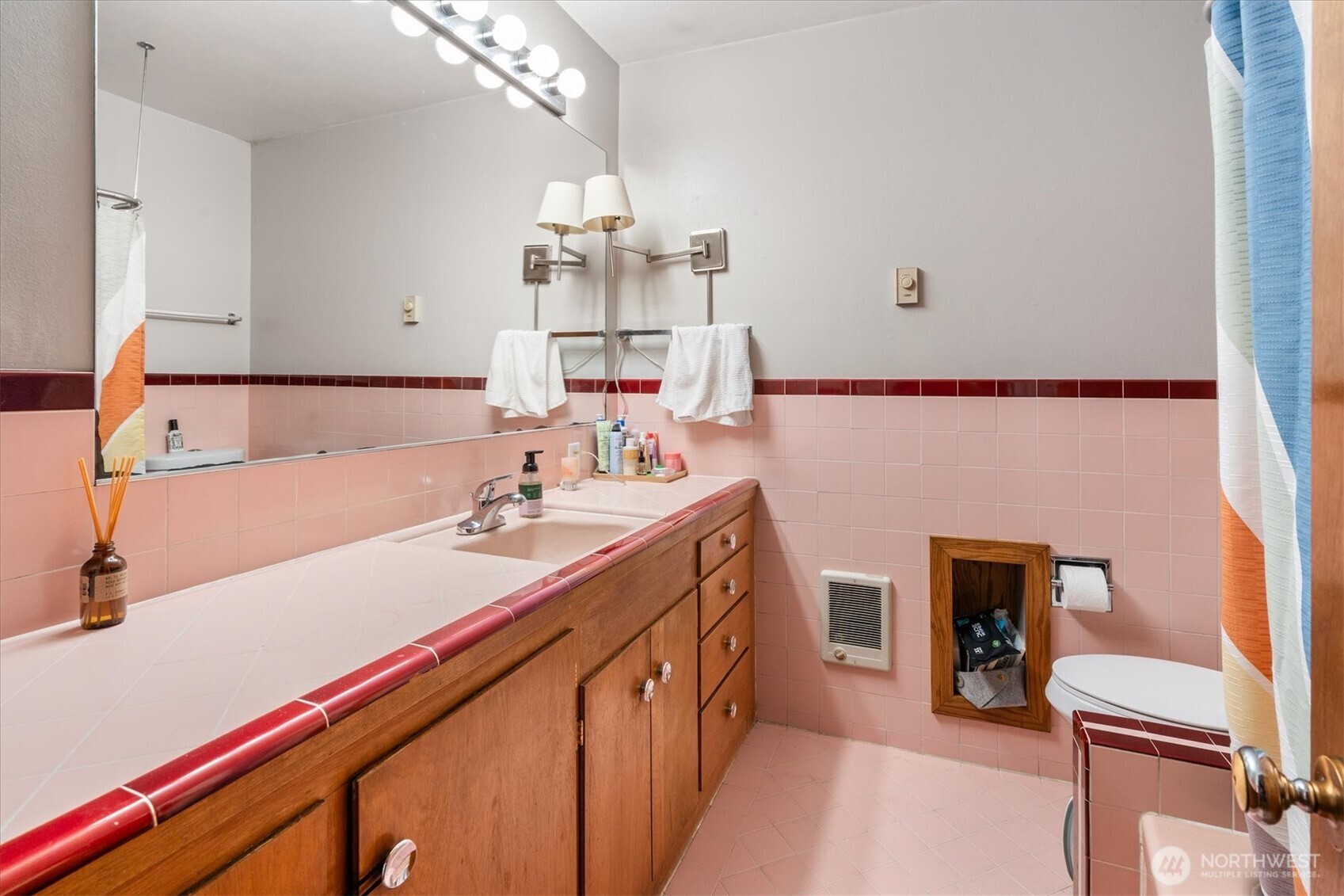 5638 3rd Avenue Northwest Seattle, WA 98107 - Photo 27 of 40 a bathroom with a double vanity sink a mirror and a bathtub