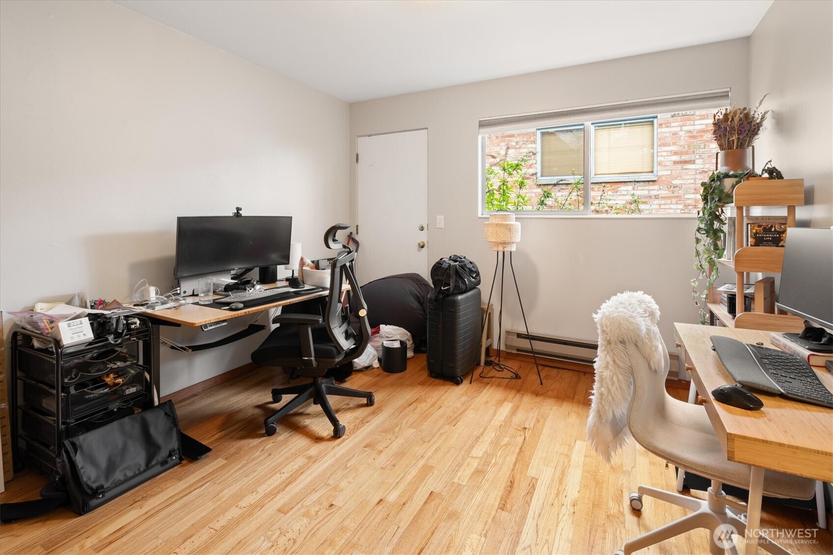 5638 3rd Avenue Northwest Seattle, WA 98107 - Photo 29 of 40 a view of a workspace with furniture and a window