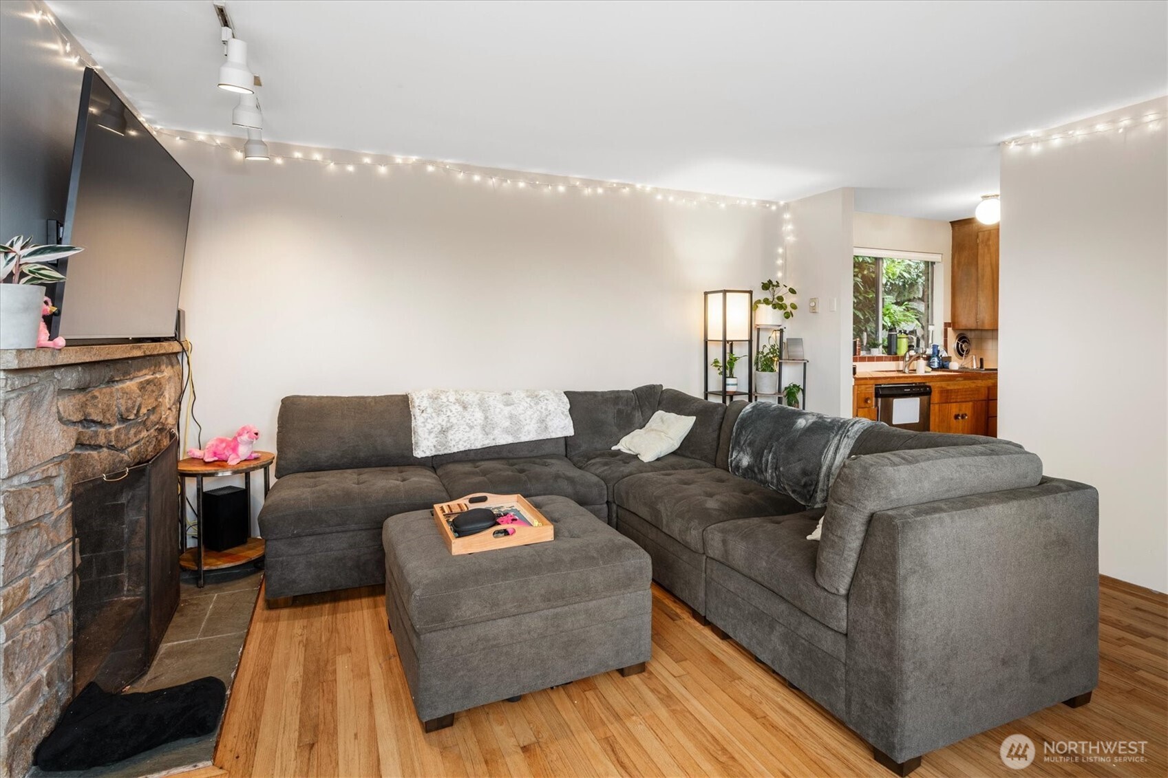 5638 3rd Avenue Northwest Seattle, WA 98107 - Photo 31 of 40 a living room with furniture and a flat screen tv