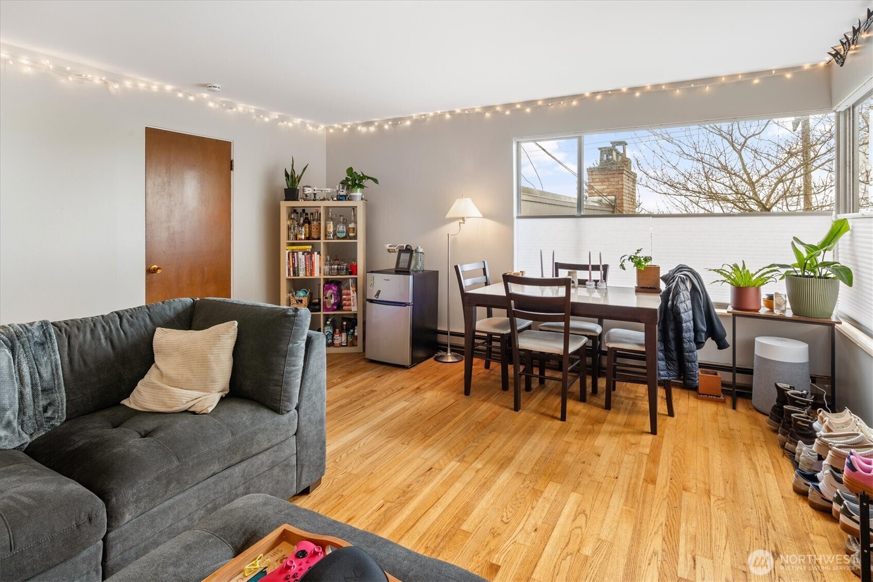 5638 3rd Avenue Northwest Seattle, WA 98107 - Photo 32 of 40 a living room with furniture and wooden floor