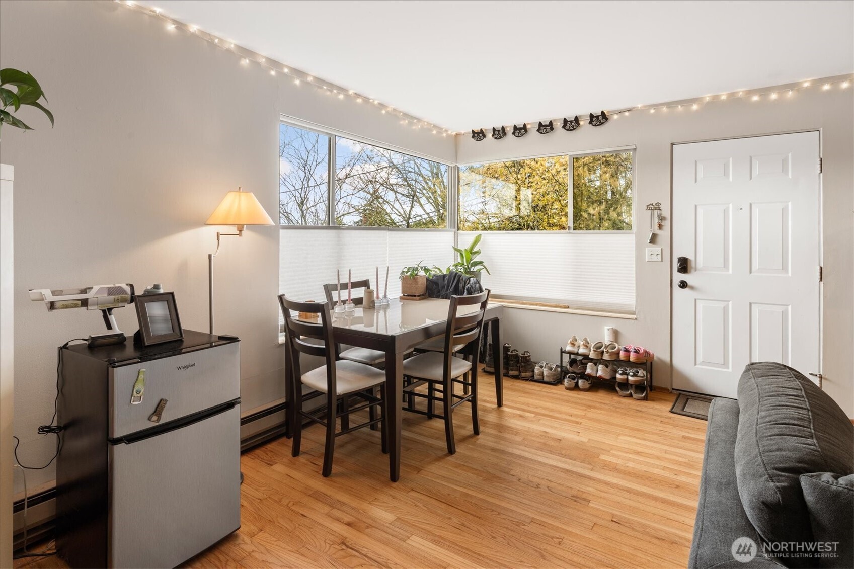 5638 3rd Avenue Northwest Seattle, WA 98107 - Photo 33 of 40 a view of a dining room with furniture and wooden floor