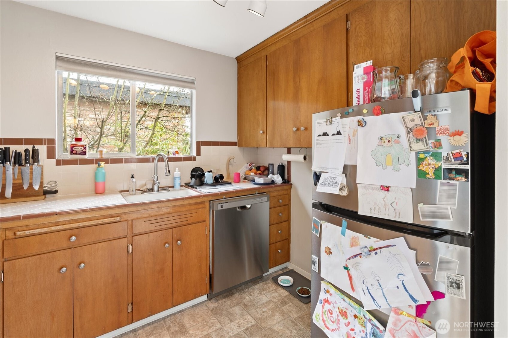 5638 3rd Avenue Northwest Seattle, WA 98107 - Photo 35 of 40 a kitchen with white cabinets and window