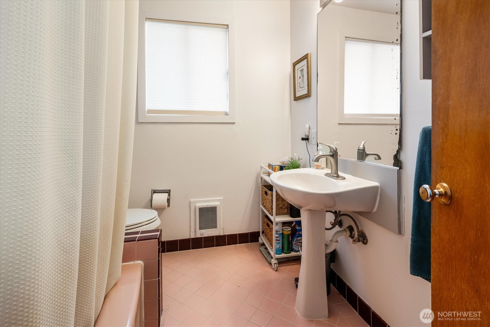 5638 3rd Avenue Northwest Seattle, WA 98107 - Photo 36 of 40 a bathroom with a sink a mirror and a toilet