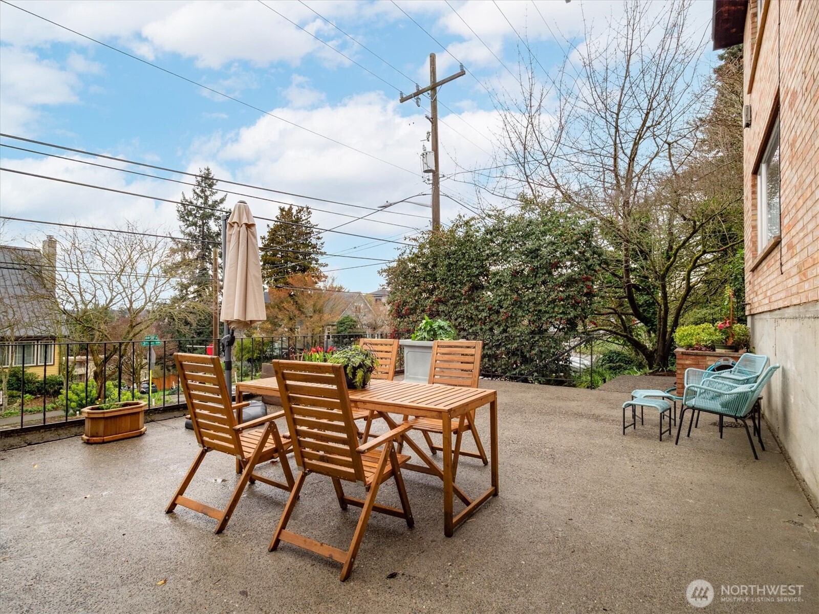 5638 3rd Avenue Northwest Seattle, WA 98107 - Photo 4 of 40 a view of a patio with a table and chairs and couches