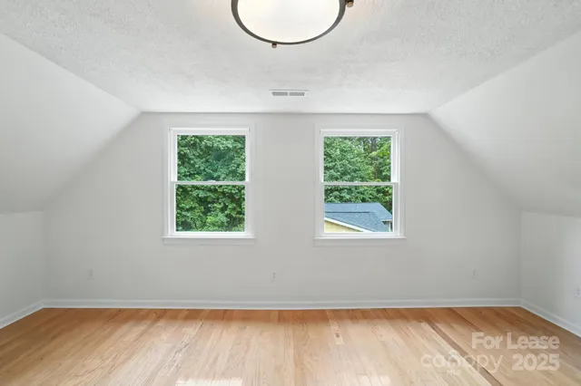 a view of balcony with wooden floor and fence