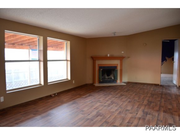 740 North Tubac Road Prescott, AZ 86303 - Photo 14 of 20 a view of an empty room with wooden floor and a window