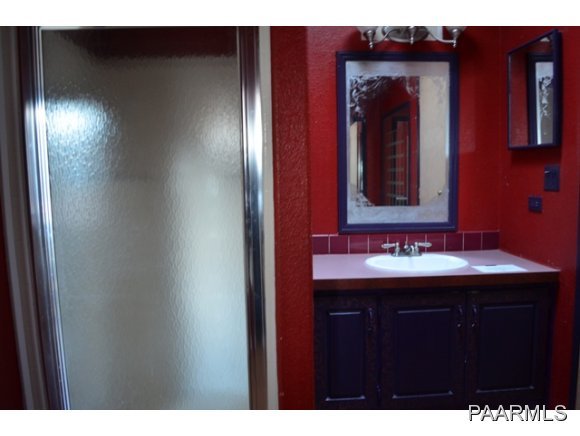 740 North Tubac Road Prescott, AZ 86303 - Photo 15 of 20 a bathroom with a sink and a mirror