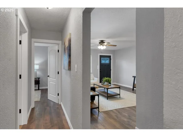 a view of a livingroom with furniture and wooden floor