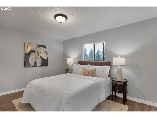 a bedroom with a bed and a lamp