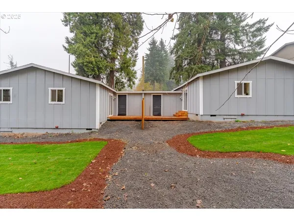 a backyard of a house with yard and outdoor seating