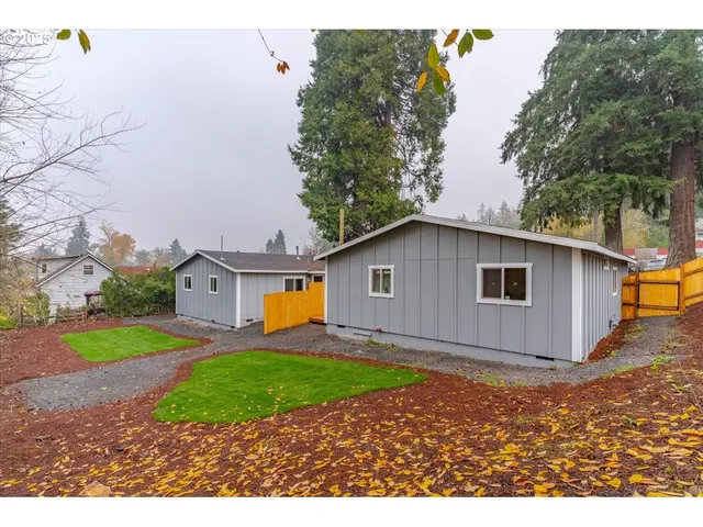 a view of a backyard of the house