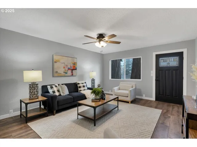 a living room with furniture and a window